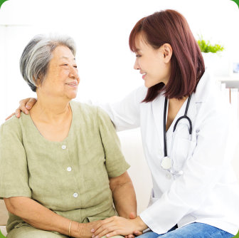 female doctor comforting old woman